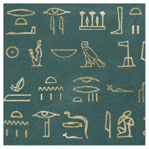 Metallische ägyptische Hieroglyphen auf Waldgrün