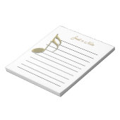 Metallische Gold-Musiknote auf Papierpad Notizblock (Rotiert)