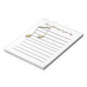 Metallische Gold-Musiknoten auf der Pad Notizblock (Rotiert)