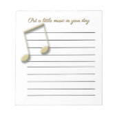 Metallische Gold-Musiknoten auf der Pad Notizblock (Vorderseite)