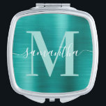 Metallisches Aqua-Aquamarin-Signature-Monogramm Taschenspiegel<br><div class="desc">Erstellen Sie Ihren eigenen personalisierten Namen und einen mit Monogramm Kompaktspiegel für eine Brautjungfrau. Die Aqua-aquamarine Imitate,  die digitale Kunstgrafik aus metallischer Folie,  drucken wie ein Foto. Helle aquamarine,  grüne und weiße zeitgenössische Monogramm mit elegantem Kalligrafiedesign im Stil der Signatur können individuell angepasst werden.</div>