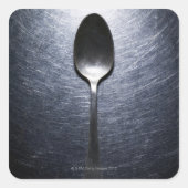 Metalllöffel auf Edelstahl Quadratischer Aufkleber (Vorderseite)