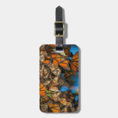 Migrating monarch butterflies cling to leaves gepäckanhänger (Vorderseite vertikal)