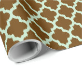 Miniaturgrüne Kat-Folie über braunem Hintergrund Geschenkpapier (Rolleneckpunkt)