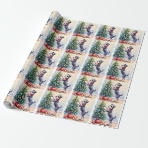 Miniaturschnauzer beim Schmücken des Weihnachtsbau Geschenkpapier