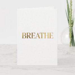 Minimalist typography with gold word breathe karte