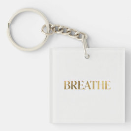 Minimalist typography with gold word breathe schlüsselanhänger