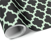 Mint-grüner Ikat-Quatrefolie über schwarzem Hinter Geschenkpapier (Rolleneckpunkt)