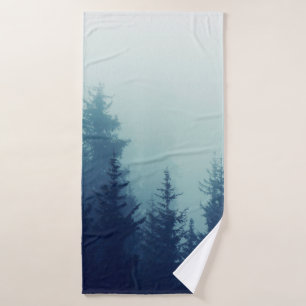 Misty fog in pine forest on mountain slopes. Color Badehandtuch