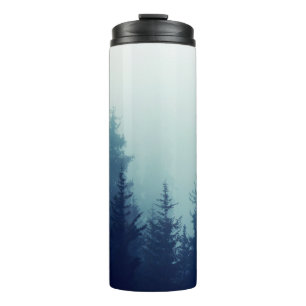 Misty fog in pine forest on mountain slopes. Color Thermosbecher