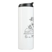 Mit Blume ein weiteres Kapitel Buchwurm buchen Thermosbecher (Nach links gedreht)