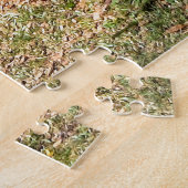 Mit Blumen gefülltes Boot am See Puzzle (Seite)