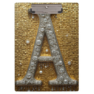 Mit Juwelen besetzter Buchstabe A auf goldenem Mos Klemmbrett