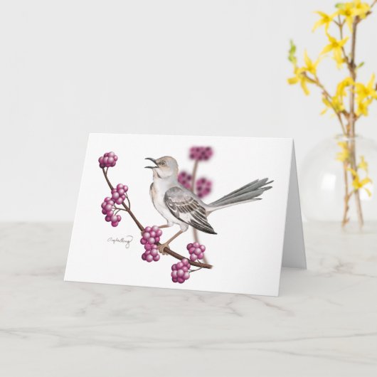 Mockingbird Singing auf einer Zweigstelle mit Berr Karte (Gelbe Blume)