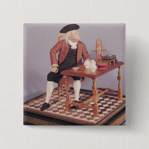 Modell von Benjamin Franklin an seinem Tisch Button