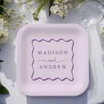 Modern Purple Wavy Frame Wedding Pappteller<br><div class="desc">Add a stylish touch to your wedding reception, rehearsal dinner, engagement party, or wedding shower with these Modern Purple Wavy Frame paper plates. The retro wedding paper plates display the couple's names in bold purple lettering surrounded by a purple wavy border contrasting with a light purple background. The trendy wedding...</div>