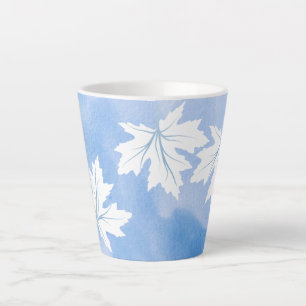 Moderne blaue Aquarellfarben und Blätter aus weiße Milchtasse