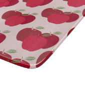 Moderne elegante rote Apfelmuster Schneidebrett (Ecke)