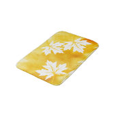 Moderne gelbe Aquarellfarben und Blätter aus weiße Badematte (Schrägansicht)