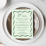 Moderne Green Wavy Frame Wedding Menükarte<br><div class="desc">Fügen Sie Ihrer Verlobungsfeier, dem Probe-Dinner oder dem Hochzeitsempfang eine Vintage Touch mit diesem Hochzeitsmenü des Modern Green Wavy Frame hinzu. Das Design zeigt die Namen der Paare, das Hochzeitstag und die Menüoptionen in fett grüner Schrift, umgeben von einem grünen Rahmen mit einem hellgrünen Hintergrund. Das Retro-Hochzeitsmenü koordiniert mit unserer...</div>