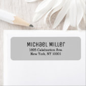 Moderne minimale hellgraue und schwarze Rücksendea (Insitu)