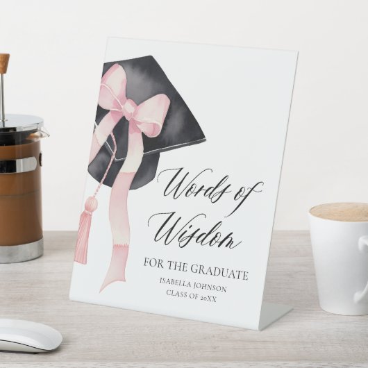 Moderne rosa Bow Grad Party Ratschläge Worte der W Sockelschild (In SItu)
