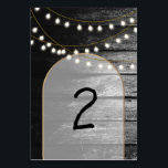 Moderne Rustikale Schwarz-Holz Gold Lights Arch We Tischnummer<br><div class="desc">Eine schöne Verbindung aus rustikalem Holz kombiniert mit dem modernen schicken goldenen eleganten Lichter und Bogen. Ein einzigartiges Design, das Schwarz-Weiß-Töne mit einem Hauch von elegantem Gold verwendet. Ein Landhausstil trifft auf den Glamour der Stadt. Rustikales Hochzeitsdesign mit modernem Tischnummer. Auch die passenden Hochzeitseinladungen und andere Schreibwaren sind verfügbar. Passen...</div>