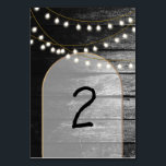 Moderne Rustikale Schwarz-Holz Gold Lights Arch We Tischnummer<br><div class="desc">Eine schöne Verbindung aus rustikalem Holz kombiniert mit dem modernen schicken goldenen eleganten Lichter und Bogen. Ein einzigartiges Design, das Schwarz-Weiß-Töne mit einem Hauch von elegantem Gold verwendet. Ein Landhausstil trifft auf den Glamour der Stadt. Rustikales Hochzeitsdesign mit modernem Tischnummer. Auch die passenden Hochzeitseinladungen und andere Schreibwaren sind verfügbar. Passen...</div>
