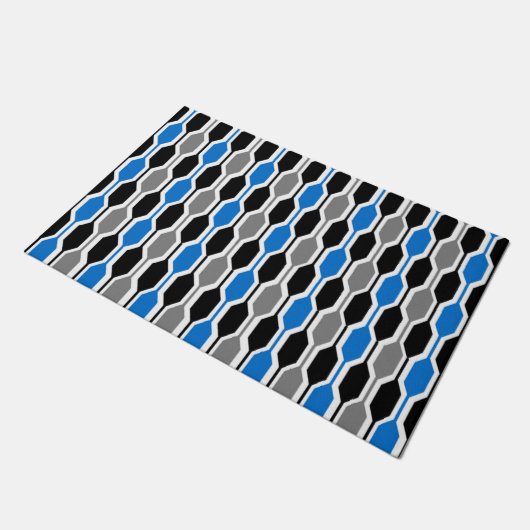 Moderne, schwarze, blaue und graue Hexagonen aus d Fußmatte (Schrägansicht)