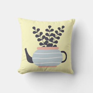 Moderne Teekanne mit Pflanze in Pastelltönen Kissen