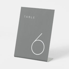 Moderner Minimalistischer Grautisch mit weißer Tis Sockelschild