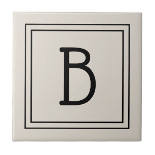 Modernes Farmhaus-Monogramm in Beige und Schwarz Fliese