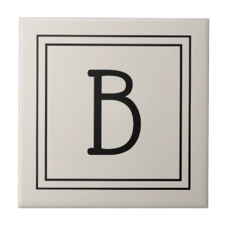 Modernes Farmhaus-Monogramm in Beige und Schwarz Fliese