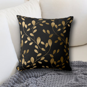 Modernes Gold Leaf-Muster auf dem schwarzen Kissen