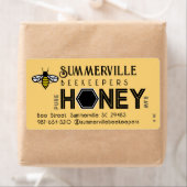 Modernes Honey-Label mit Hexagon-Grenze und Biene (Insitu)