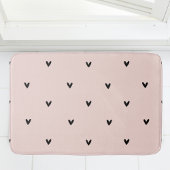 Modernes, pastellrosa und schwarzes Herzmuster Badematte