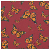 Monarch Butterfly-Muster auf dunkelrotem Hintergru Stoff (Nahaufnahme)