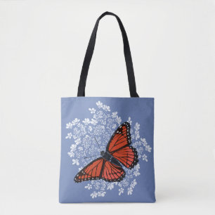 Monarch-Schmetterling auf der Anne der Königin Tasche
