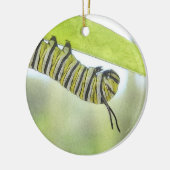 Monarch-Schmetterlings-Raupe, die einen Milkweed Keramikornament (Links)