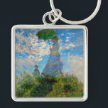 Monet Woman Parasol Impressionismus Schlüsselanhänger<br><div class="desc">Claude Monet Impressionismus Meisterwerk - Die Frau mit einem Parosol wurde 1875 vom französischen Impressionisten Claude Monet gemalt. Es zeigt eine Frau mit Sonnenschirm und ein kleines Kind, die Madame Monet und ihr Sohn ist. Dieses impressionistische Gemälde ist eines der berühmten Gemälde Monets, das eine schöne Landschaft mit leuchtend blauem...</div>