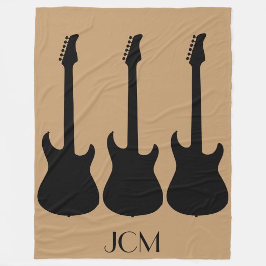 Monogram Black Electric Gitarren auf Camel Brown Fleecedecke (Vorderseite)