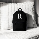 Monogram Elegant Minimalistisch Black Bedruckter Rucksack<br><div class="desc">Die ultimative Fusion von Spaß und Funktionalität: Unser bezauberndes Rucksack für Kinder und Jugendliche. Mit seinen spielerischen Pastellpinken, cooler Wassergymnastik und Touchs glitzernden Goldes inmitten eines kristallartigen Musters ist dieser Rucksack ein fröhliches Jugendreperlebnis. Und der Zauber hört nicht auf - machen Sie es einzigartig mit personalisierter Monographie! Egal ob Sie...</div>