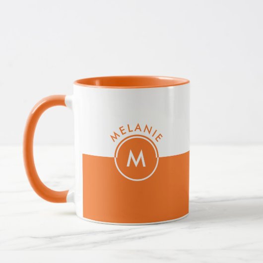 Monogramm auf weißem und orangefarbenem Trennbilds Tasse (Links)