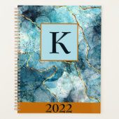 Monogramm aus blauem und goldglattem Marmor, benut Planer (Vorderseite)