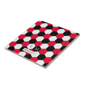 Monogramm aus roten, schwarzen und weißen Hexagone Fliese (Seite)