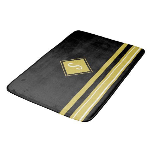 Monogramm der modernen schwarzen und goldenen Stre Badematte (Schrägansicht)
