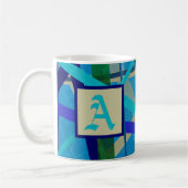 Monogramm für blaues und grünes geometrisches Must Kaffeetasse (Links)