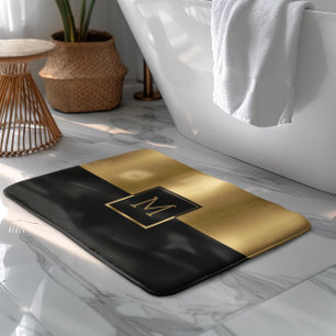 Monogramm für das geometrische Gold- und Schwarz-D Badematte