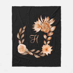 Monogrammierte schwarze braune und pfirsichfarbene fleecedecke