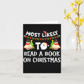 Most Likely To Read A Book On Christmas Funny Snow Karte (Gelbe Blume)